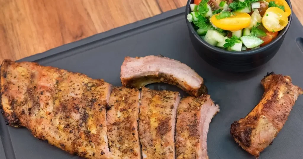 A beautifully arranged plate of thinly sliced grilled chicken breasts
