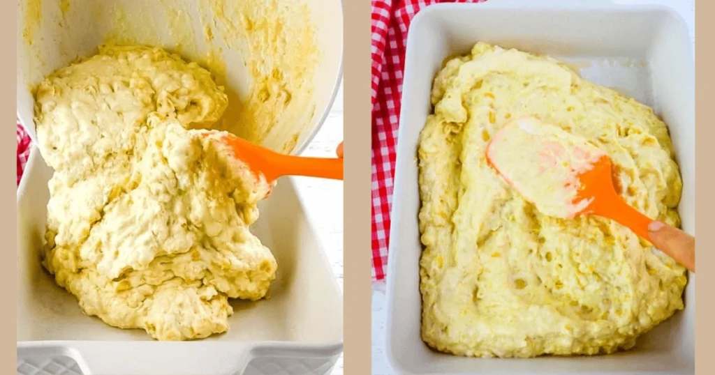 A spatula spreading creamy corn casserole batter evenly in a white baking dish, ready for baking.