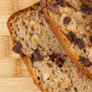 close-up shot of a slice of banana bread without butter, showcasing its moist crumb and natural banana flavor